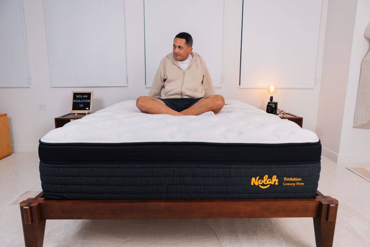A man wearing comfortable clothes crossed legs on a Nolah Evolution 15".