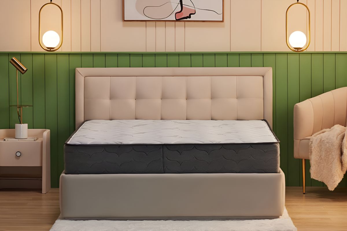 Wakefit Elevate pocket spring mattress with memory foam placed on upholstered bed in modern bedroom