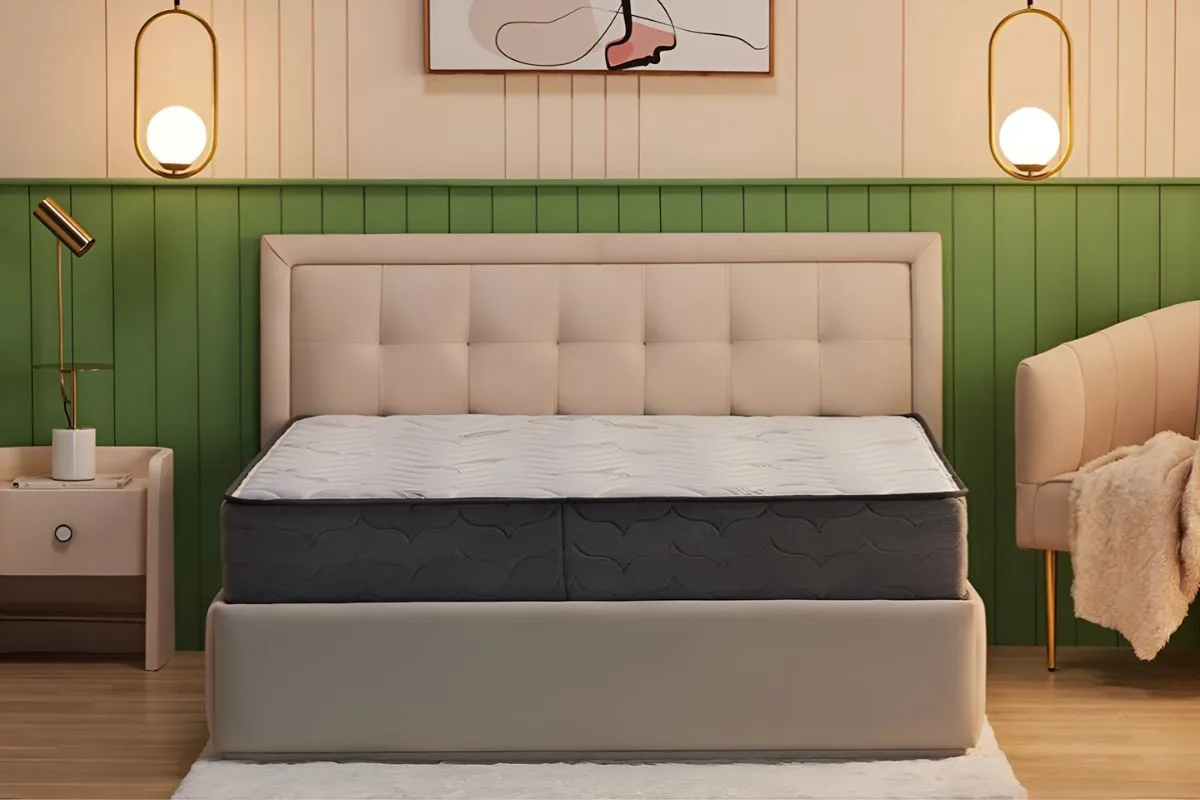 Wakefit Elevate pocket spring mattress with memory foam placed on upholstered bed in modern bedroom