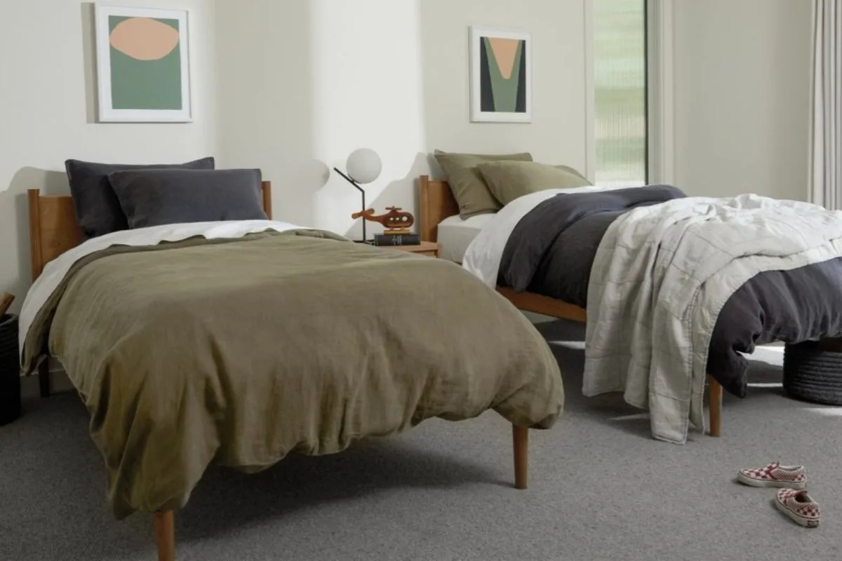 Two twin beds side by side showing the standard size and width of twin beds in a shared bedroom