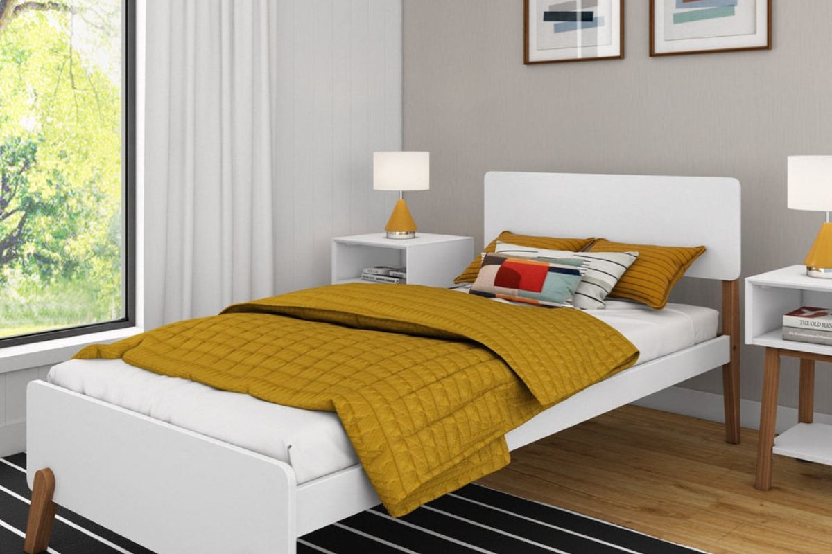 Modern twin bed frame with standard mattress height in a minimalist bedroom setup