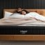 Couple relaxing on a Titan Plus Luxe Mattress during the sleep trial period to test comfort and support for heavier sleepers