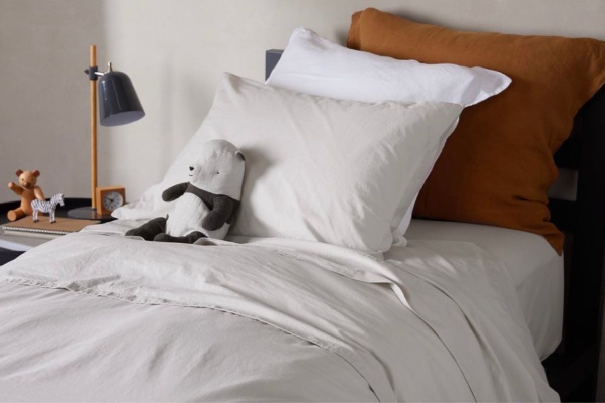 Twin mattress setup in a cozy bedroom showing a compact bed size for kids or single sleepers