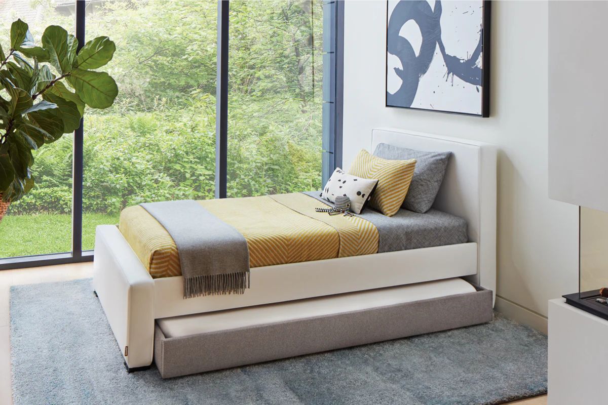 Modern twin bed with pull-out trundle showing how twin beds fit compact spaces
