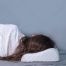 Side sleeper using a medium-loft pillow that keeps the head and neck properly aligned during sleep