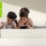 Children using a Leesa Kids Mattress with GREENGUARD Gold certification, highlighting low chemical emissions and mattress safety for kids