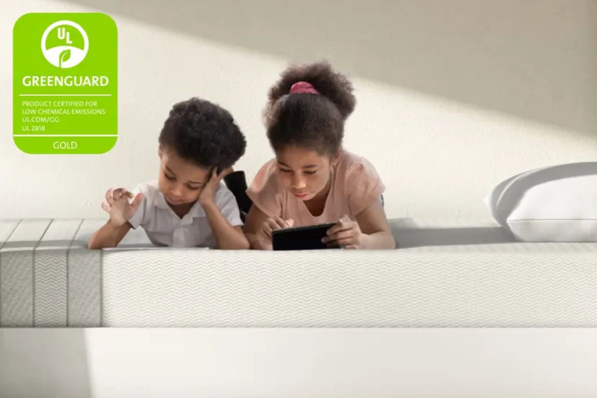 Children using a Leesa Kids Mattress with GREENGUARD Gold certification, highlighting low chemical emissions and mattress safety for kids