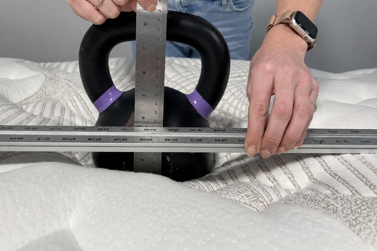 kettlebell test measuring sinkage depth on nolah evolution 15 mattress surface