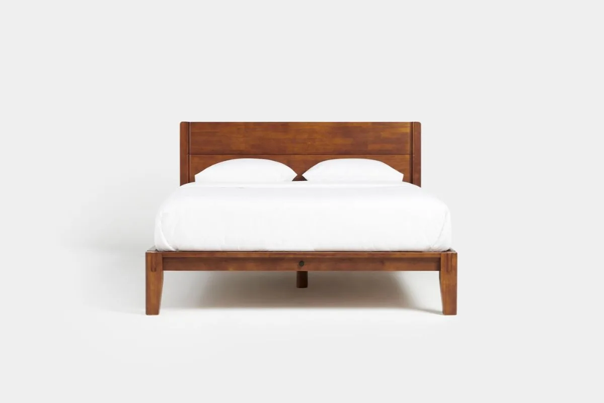 Twin XL mattress on a matching bed frame illustrating the standard dimensions of a Twin XL bed setup