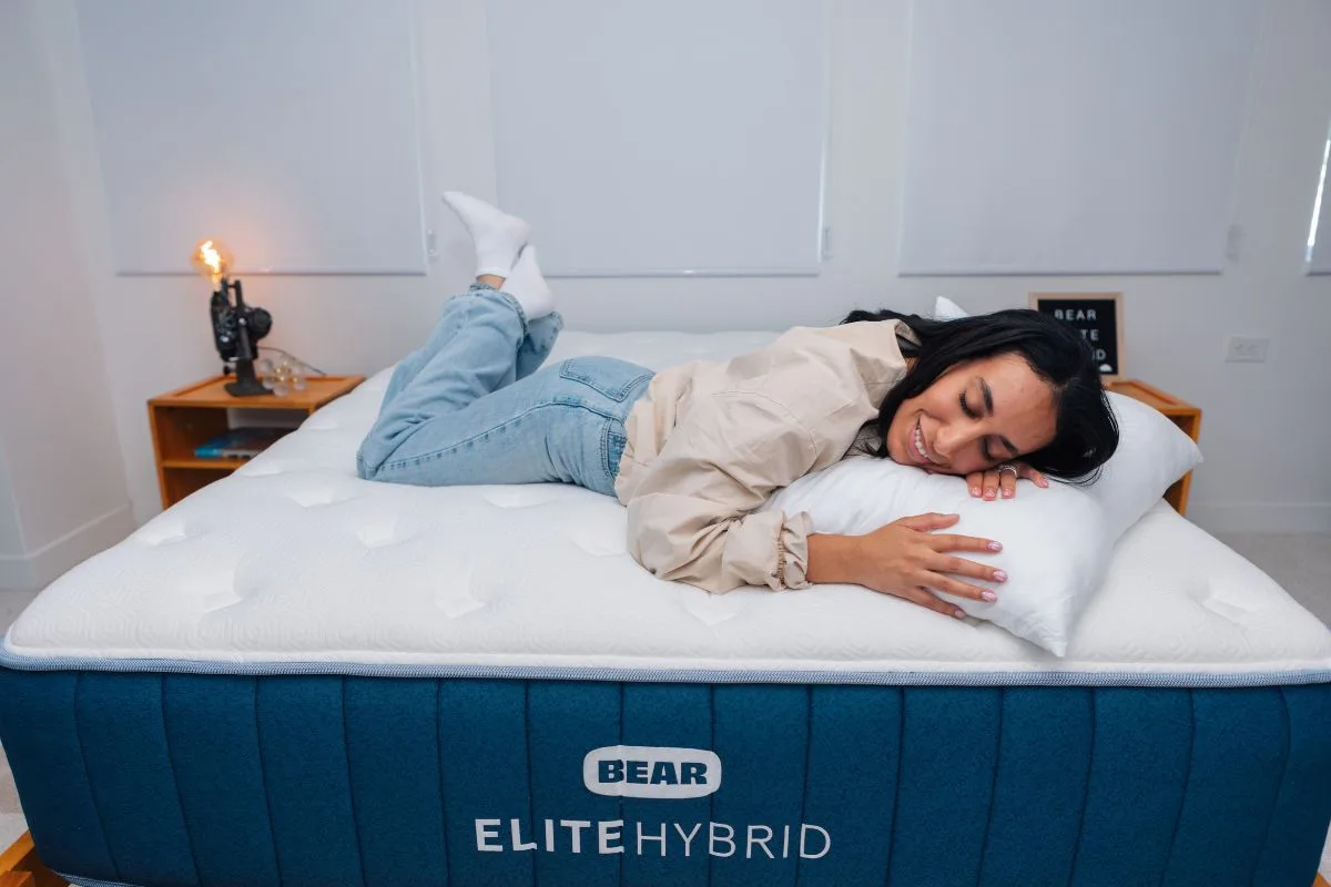 Bear Elite Hybrid mattress supporting a comfortable side sleeper, highlighting pressure relief and plush comfort for the best queen size mattress