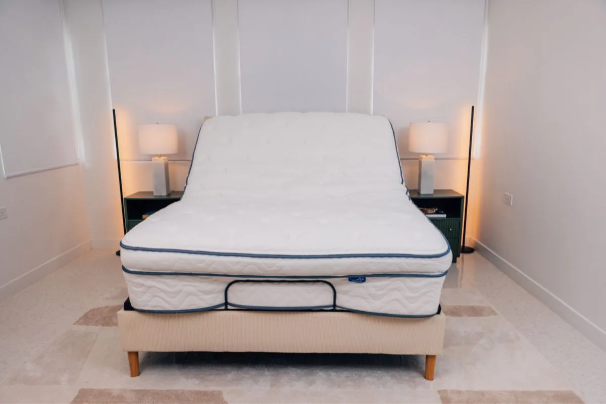 DLX Premier Hybrid mattress on an adjustable base illustrating the recommended bed frame setup for warranty protection