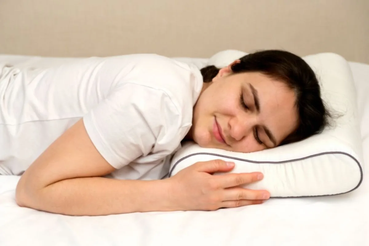 Do Stomach Sleepers Need a Soft or Firm Mattress? Stomach sleeper using a low-loft pillow and supportive mattress to maintain proper spinal alignment and reduce neck strain