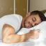 Stomach sleeper resting comfortably on a supportive mattress designed to keep the spine aligned throughout the night