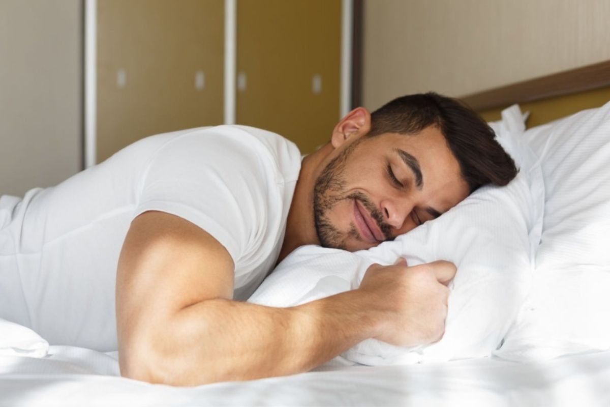 Stomach sleeper resting comfortably on a supportive mattress designed to keep the spine aligned throughout the night