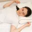 Back sleeper using a medium-loft pillow to maintain proper head, neck, and spinal alignment during sleep