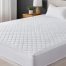 Medium-profile mattress with a quilted surface showing an ideal mattress thickness for stomach sleepers
