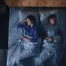 Couple sleeping in different positions to illustrate how the right mattress supports combination sleepers with minimal motion transfer